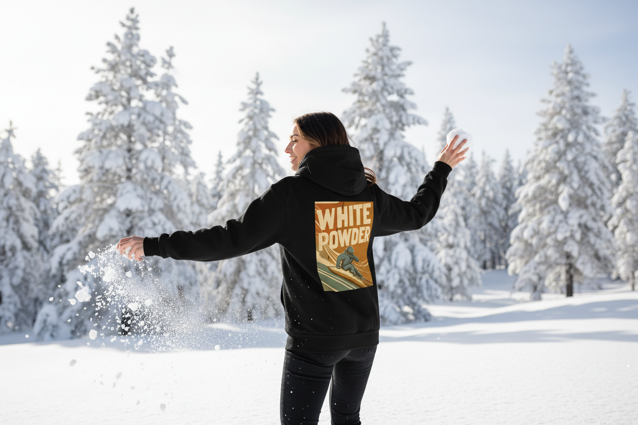 Woman throwing snowball, back view showing White Powder hoodie graphic